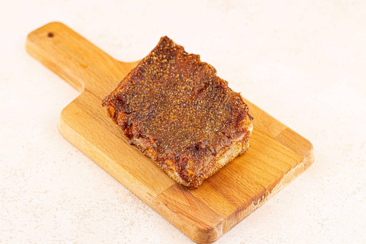 Oven-baked Baby Back Ribs on a wooden chopping board