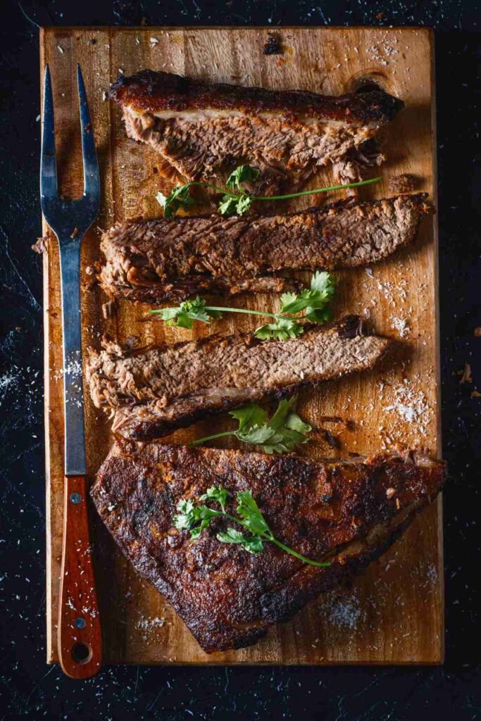 The Beef Brisket is on the Wooden Chopping Board