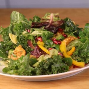 Chicken Kale Salad served in a plate.