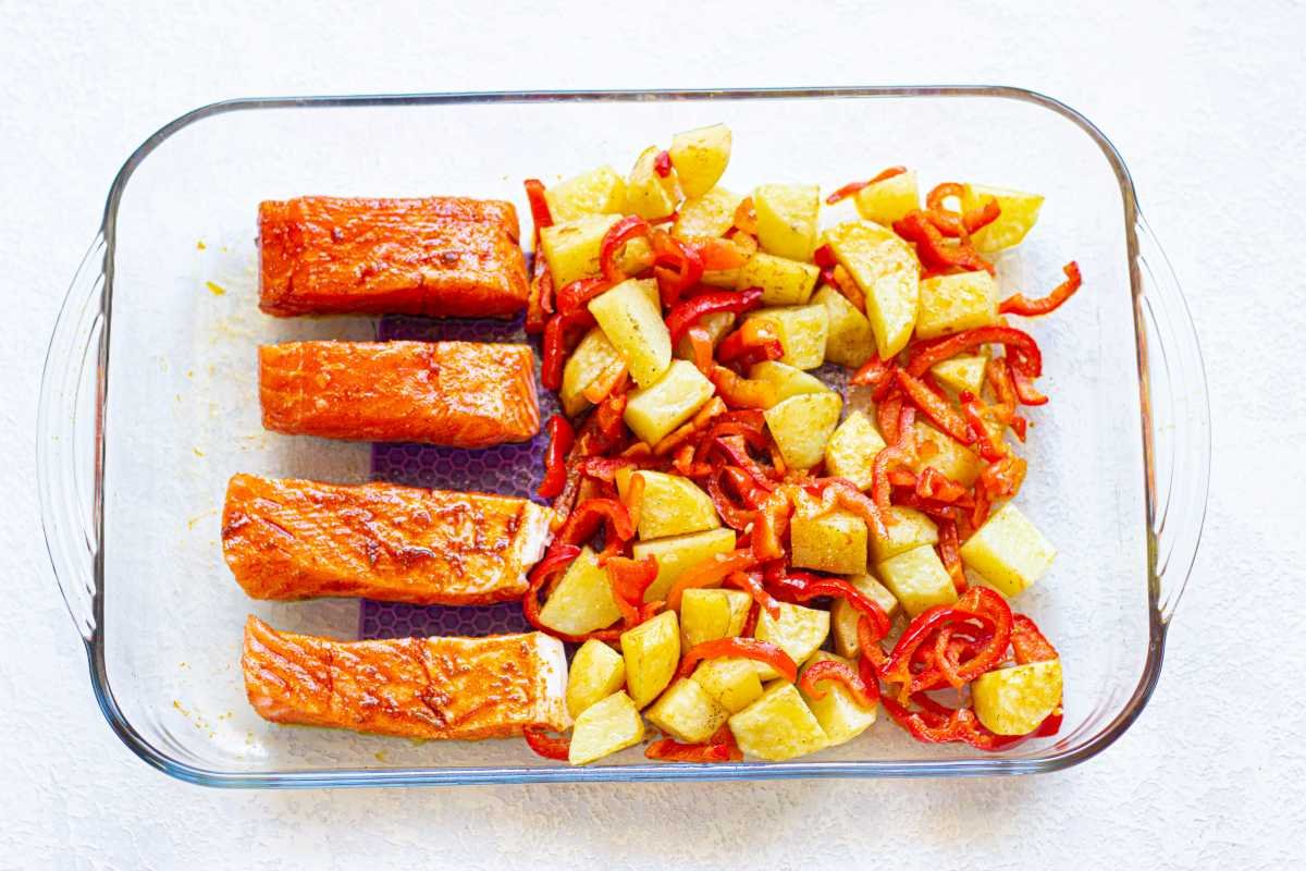 Salmon with Roasted Vegetables in a baking pan.