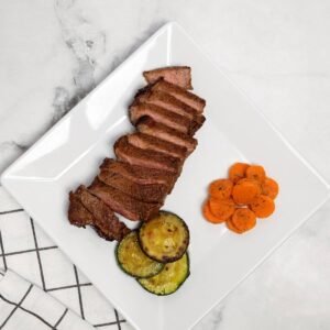 Sirloin Steak In An Air Fryer in a white plate.