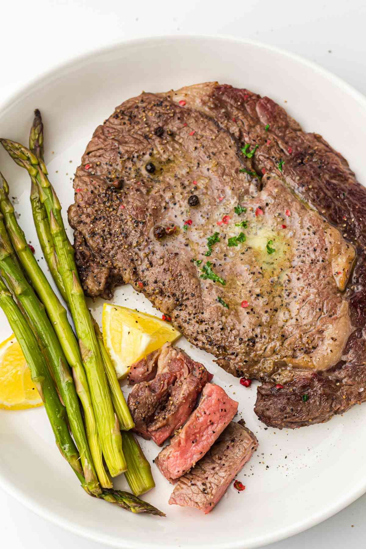 Steak with Asparagus on a white plate